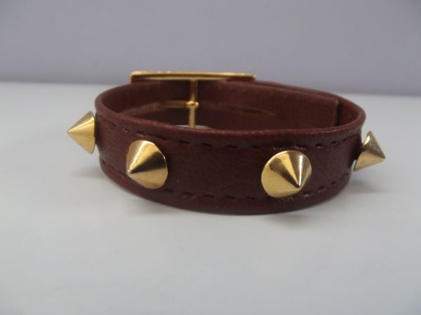 Cód:PS34- Pulseira Couro com Spikes Dourados